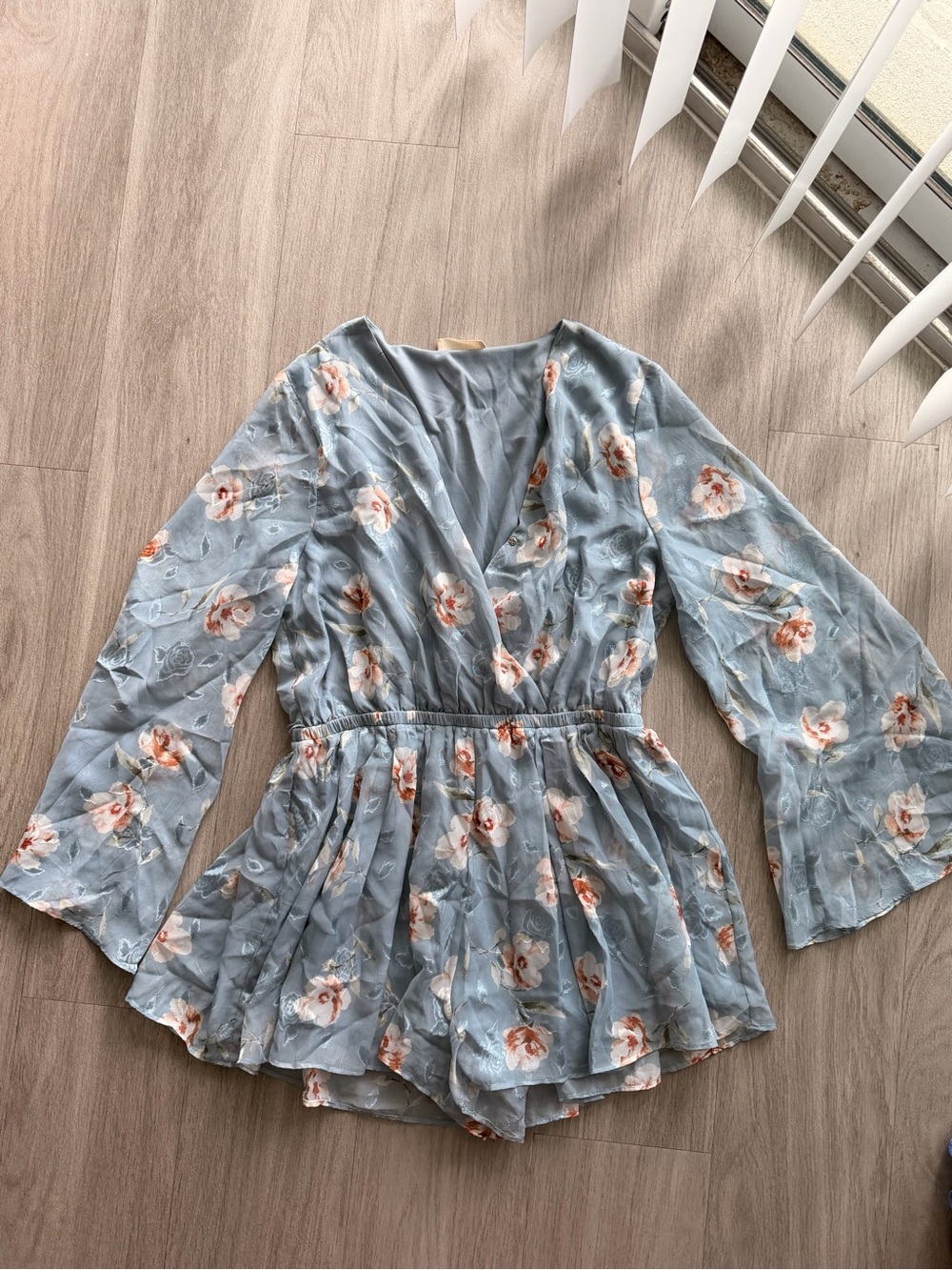 Altar'd State Light Blue Floral Wrap Romper with Bell Sleeves